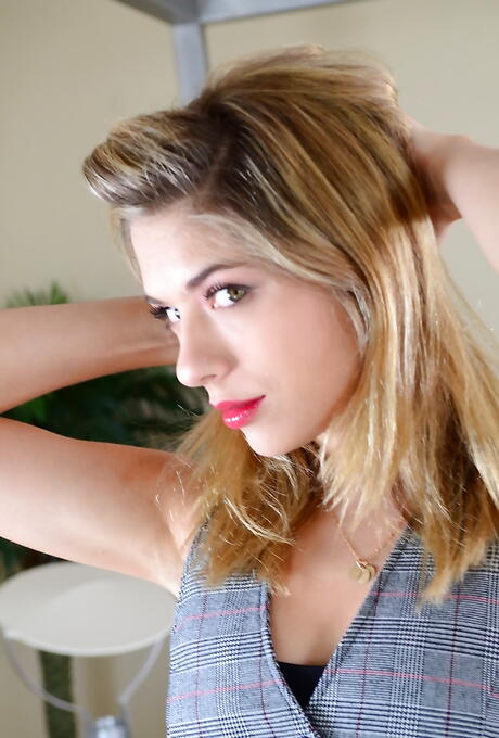 Foxy american young Lia Lor in sexy skirt exhibits her ass and spreads her legs 