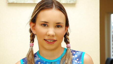 Shapely young Brandy shows big boobs and shaved pussy 