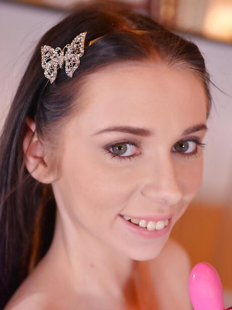 Foxy russian dark hair teen Liz Heaven in fancy shorts uncovering small tits and puting a toy in her cunt 